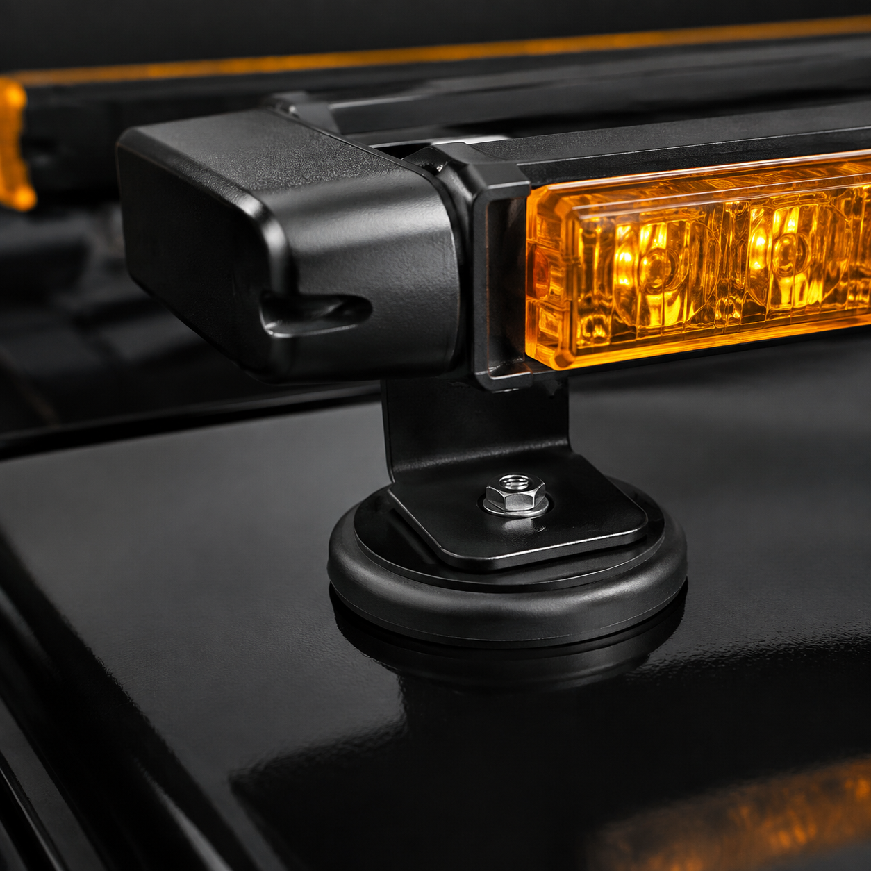 Close view of a protective magnetic mounting foot on a steel vehicle roof